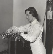 Dr. Margaret Pittman, U.S. National Institute of Health, demonstrates the Flosdorf-Mudd lyophile process which dries cultures of meningitis germs. They can be kept several years. (Cropped)